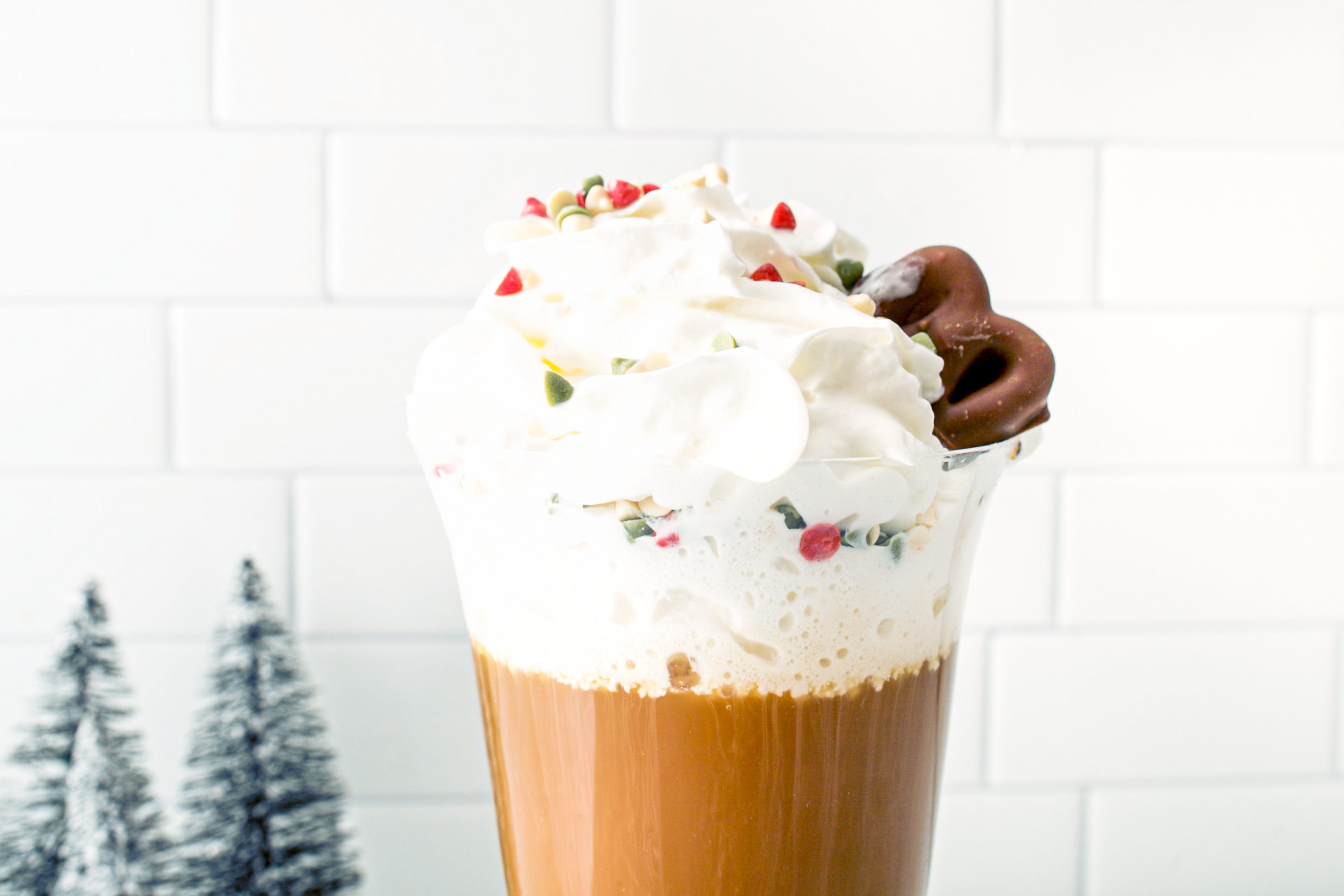 Cinnamon almond coffee paired with hall's chocolate covered pretzels for Christmas drink