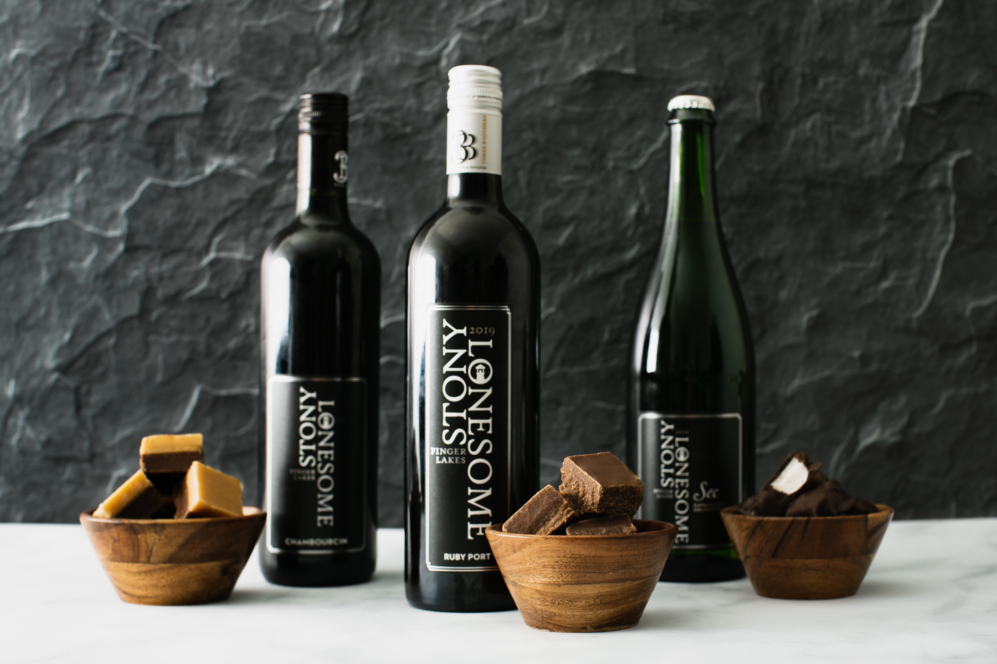 slate and marble kitchen setting with wine and candy pairings